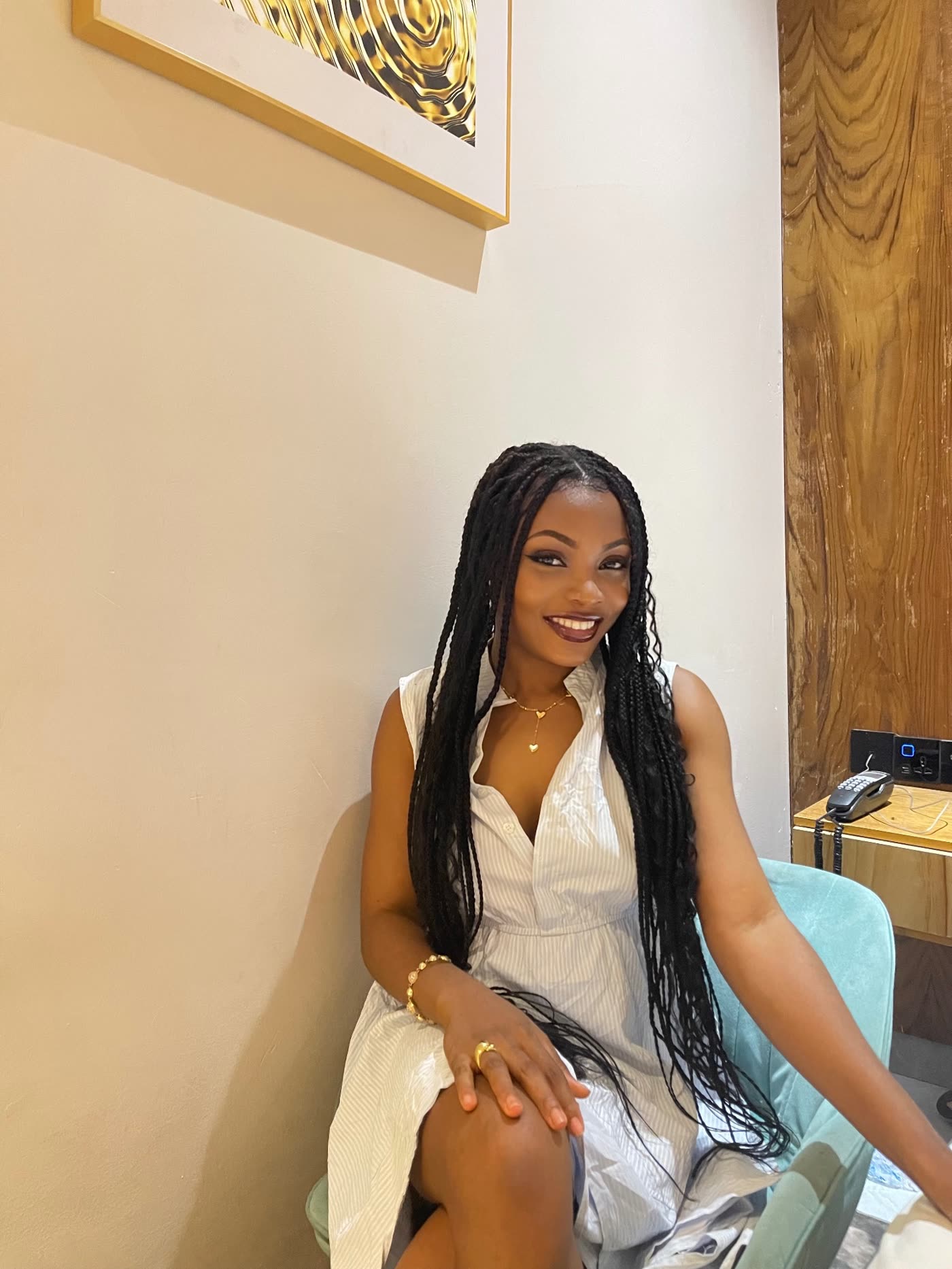 Deborah Christian smiling in a white sleeveless dress